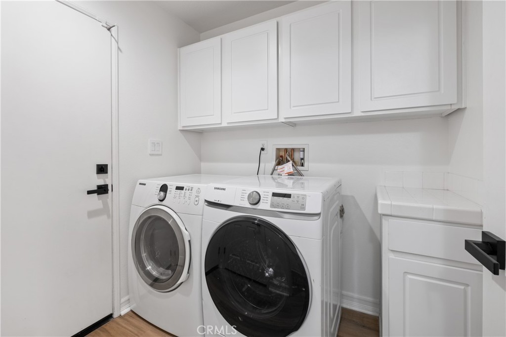 27 Reese Creek Ladera Ranch, CA 92694 - Photo 31 of 40 a utility room with dryer and washer