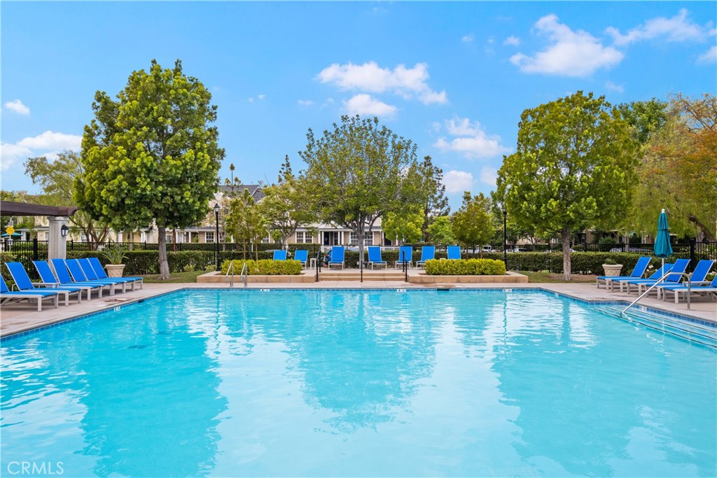 27 Reese Creek Ladera Ranch, CA 92694 - Photo 39 of 40 a view of a swimming pool with an outdoor seating and a yard