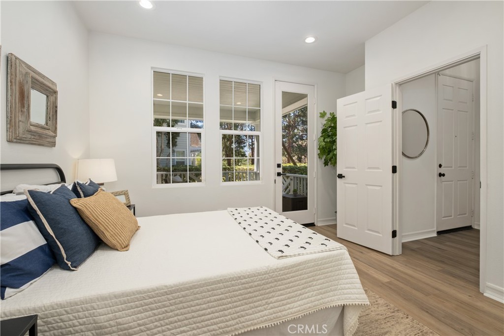 27 Reese Creek Ladera Ranch, CA 92694 - Photo 8 of 40 a bedroom with a bed a couch and a large window