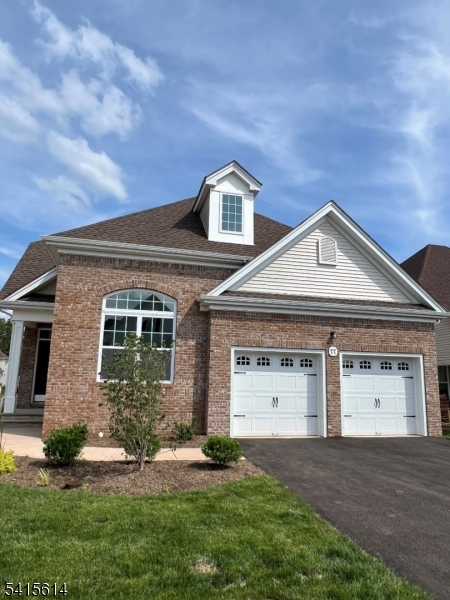 53 Norton Road Hillsborough, NJ 08844 - Photo 1 of 12 a front view of a house with a yard and garage