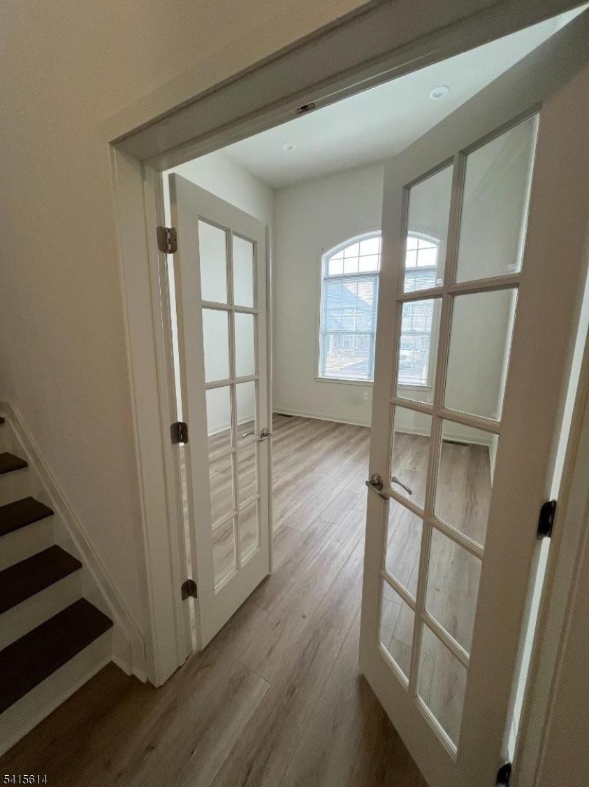 53 Norton Road Hillsborough, NJ 08844 - Photo 9 of 12 an empty room with wooden floor and windows