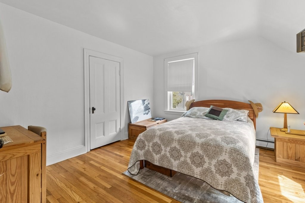 134 Bay State Road Rehoboth, MA 02769 - Photo 2 of 42 a bedroom with a bed and wooden floor