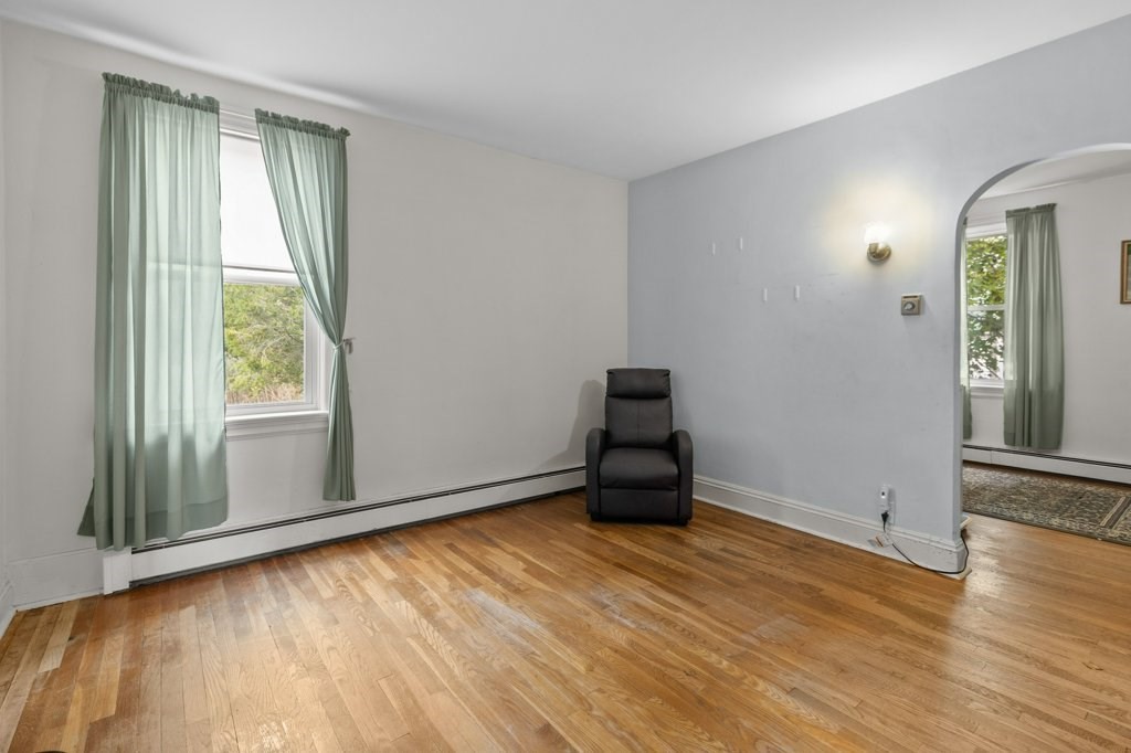134 Bay State Road Rehoboth, MA 02769 - Photo 23 of 42 an empty room with wooden floor and windows