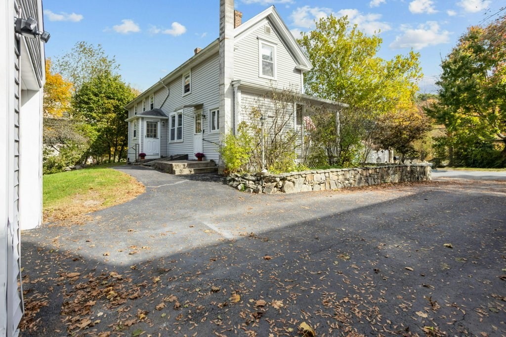 134 Bay State Road Rehoboth, MA 02769 - Photo 32 of 42 a front view of a house with a yard and garage