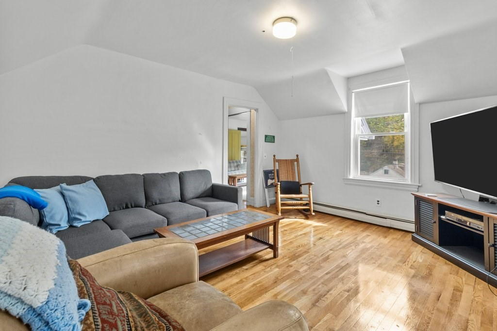 134 Bay State Road Rehoboth, MA 02769 - Photo 7 of 42 a living room with furniture and a flat screen tv
