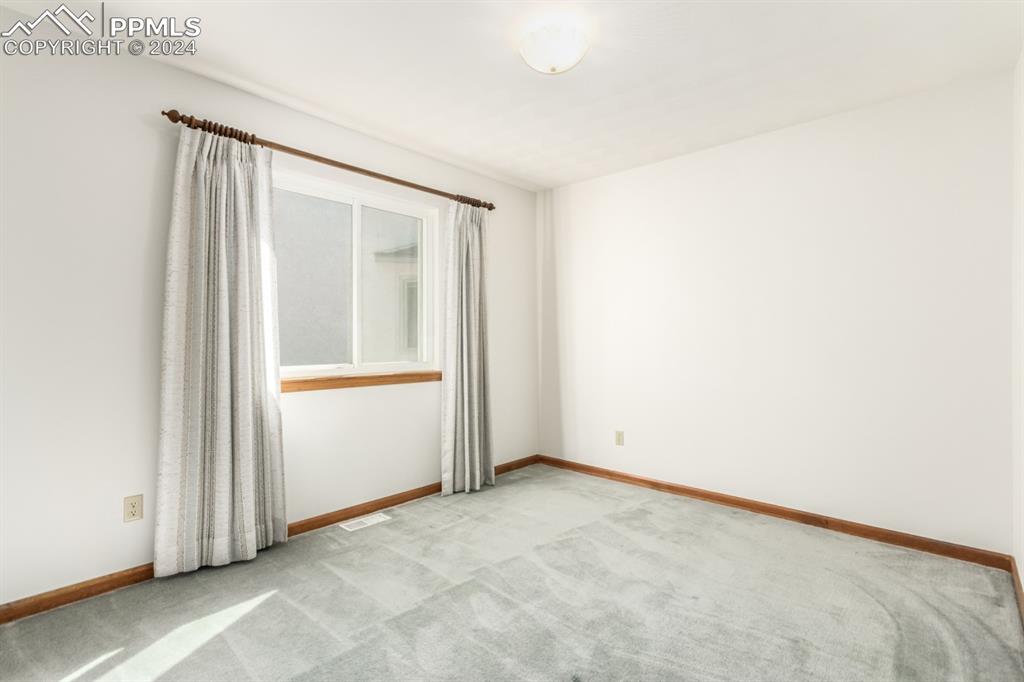 3955 Saddle Rock Road Colorado Springs, CO 80918 - Photo 27 of 45 an empty room with window