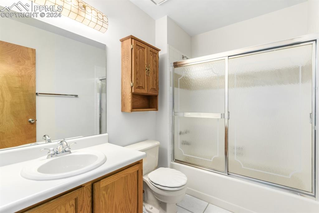 3955 Saddle Rock Road Colorado Springs, CO 80918 - Photo 29 of 45 a bathroom with a sink toilet and shower