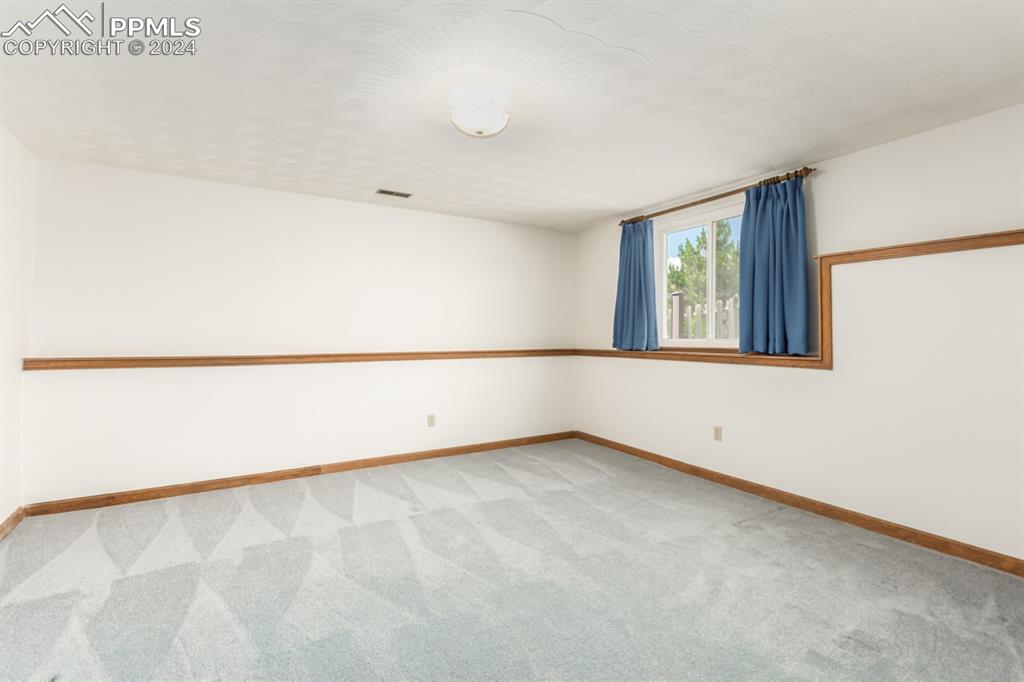 3955 Saddle Rock Road Colorado Springs, CO 80918 - Photo 34 of 45 an empty room with a window