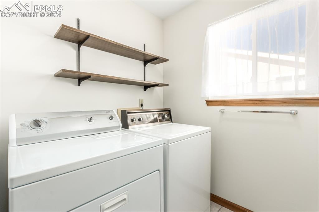 3955 Saddle Rock Road Colorado Springs, CO 80918 - Photo 36 of 45 a utility room with dryer and washer