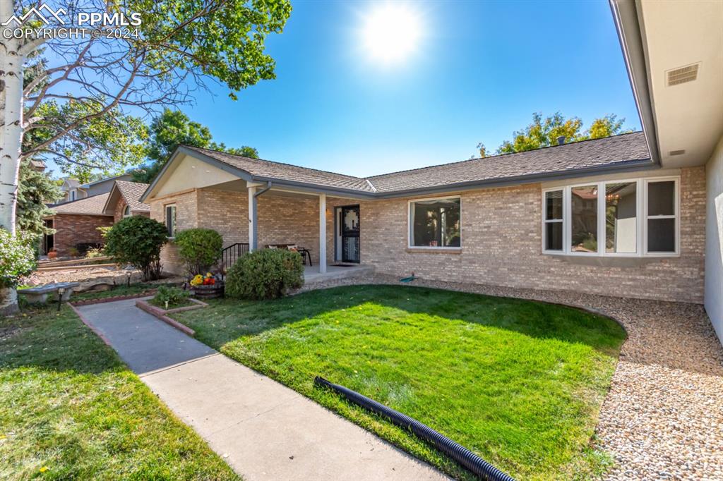 3955 Saddle Rock Road Colorado Springs, CO 80918 - Photo 4 of 45 a view of a house with a backyard