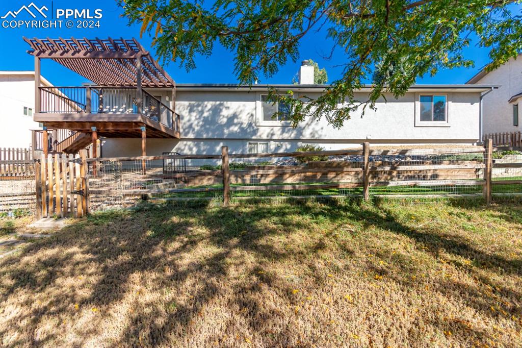 3955 Saddle Rock Road Colorado Springs, CO 80918 - Photo 43 of 45 a view of a house with a yard