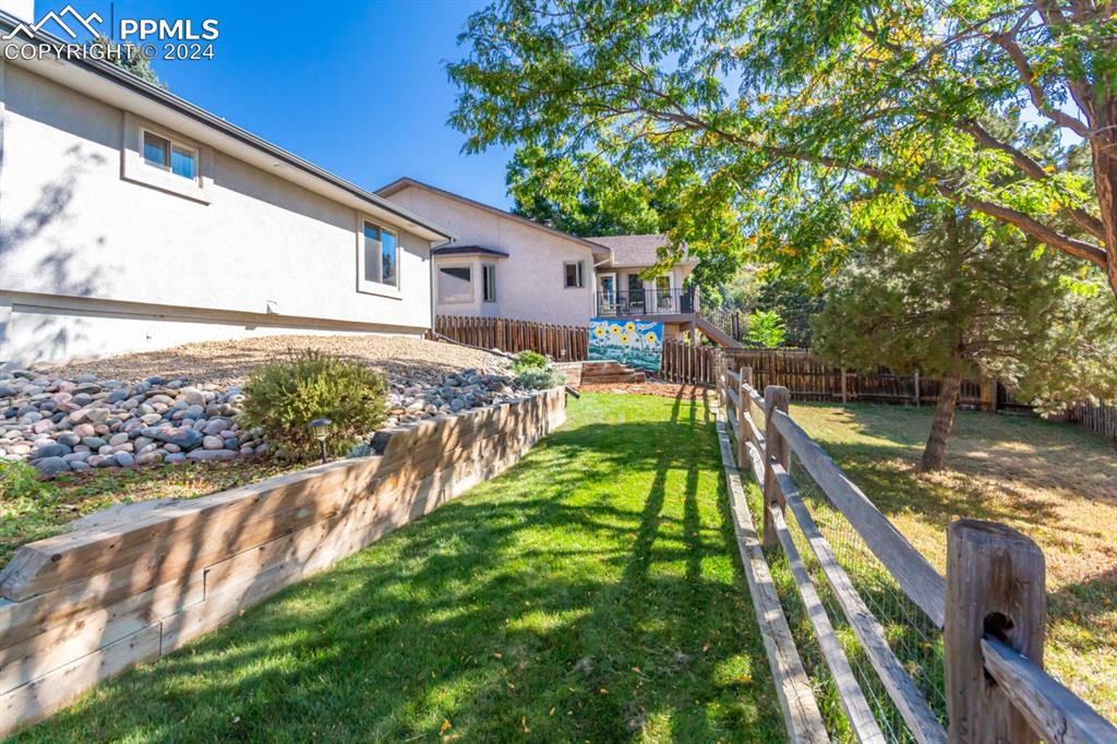3955 Saddle Rock Road Colorado Springs, CO 80918 - Photo 45 of 45 a view of an house with backyard and swimming pool