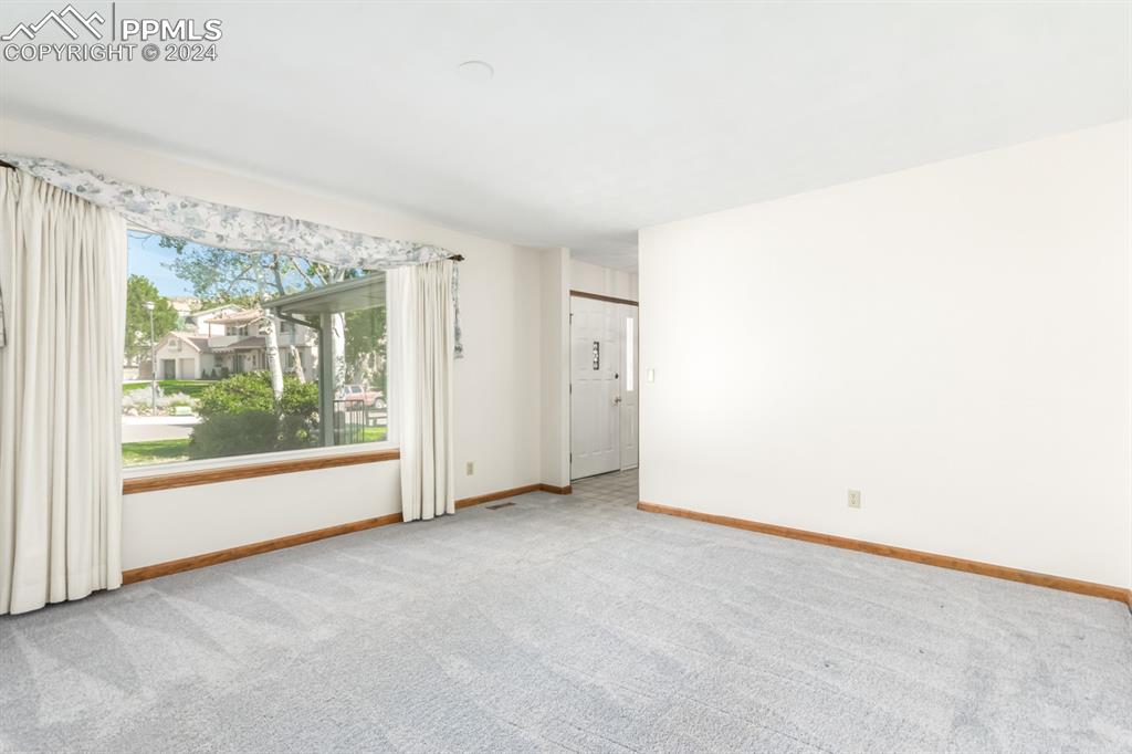 3955 Saddle Rock Road Colorado Springs, CO 80918 - Photo 7 of 45 a view of a big room with large windows