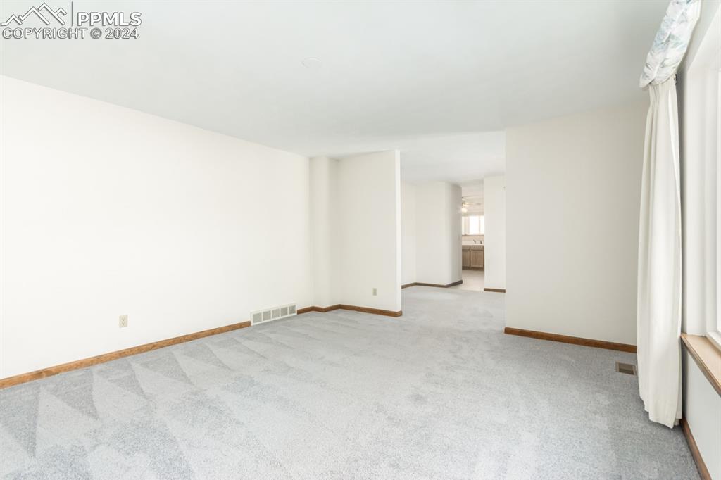 3955 Saddle Rock Road Colorado Springs, CO 80918 - Photo 8 of 45 an empty room with an entryway