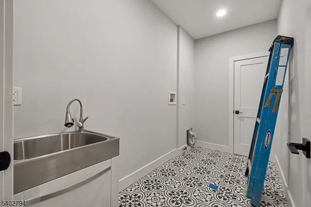 a kitchen with a sink and a refrigerator