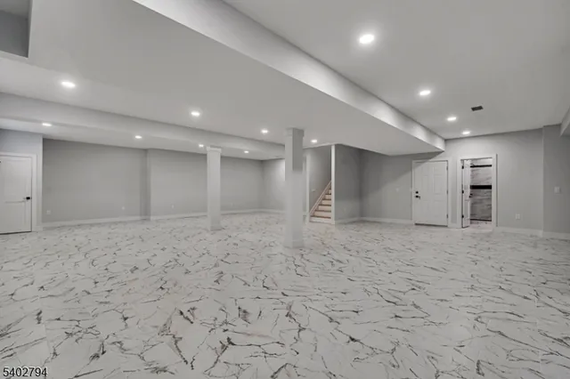 a swimming pool with an outdoor space and seating area