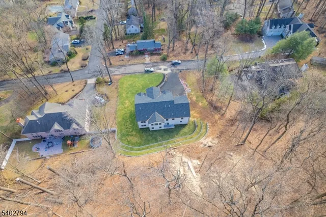 an aerial view of residential house and parking space