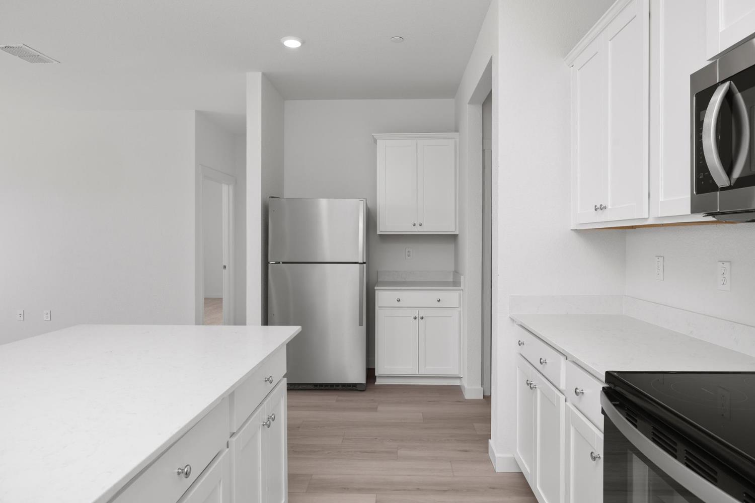 816 Chatham Lane Patterson, CA 95363 - Photo 5 of 15 a kitchen with a refrigerator and a sink