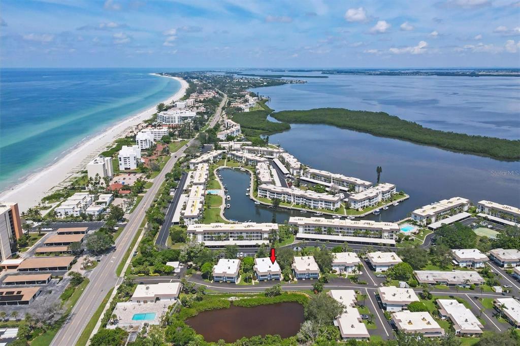 527 Sutton Place Longboat Key, FL 34228 - Photo 2 of 88 a view of a city with an ocean