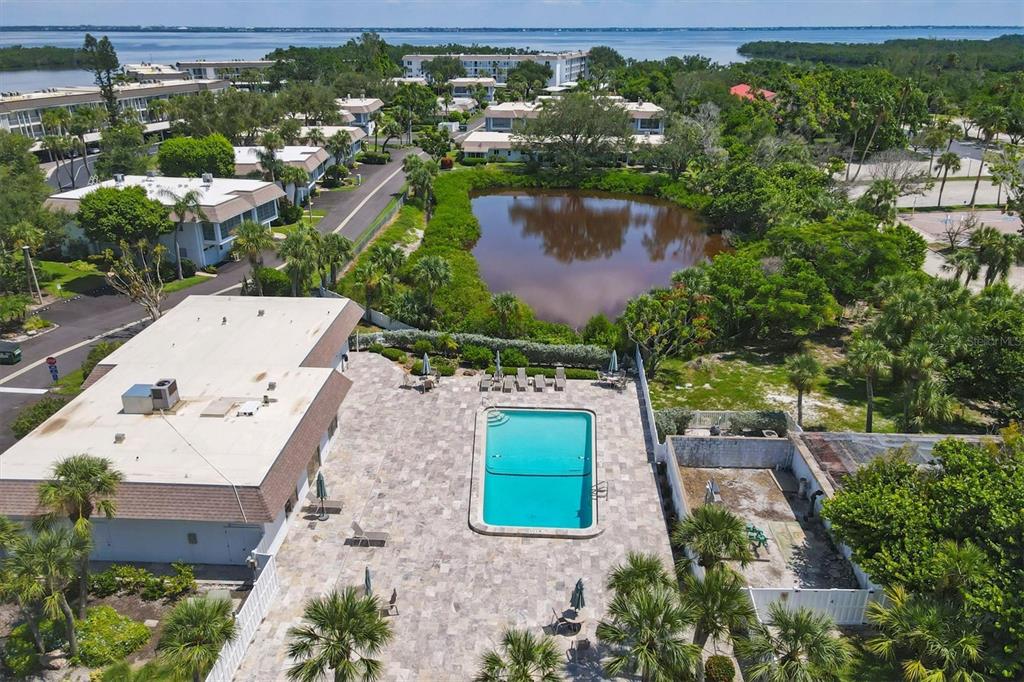 527 Sutton Place Longboat Key, FL 34228 - Photo 57 of 88 an aerial view of a house with a yard basket ball court and outdoor seating