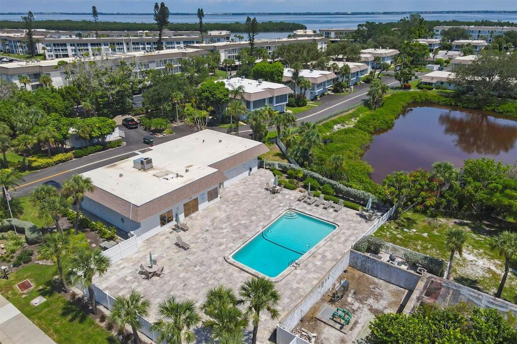 527 Sutton Place Longboat Key, FL 34228 - Photo 58 of 88 an aerial view of a house with a garden