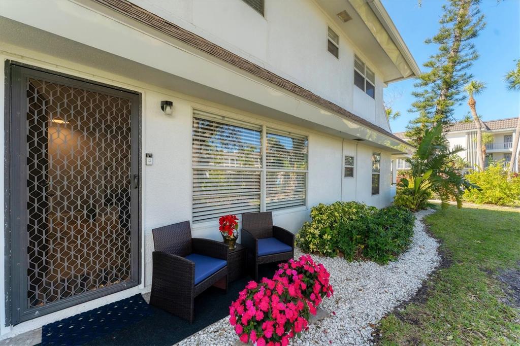 527 Sutton Place Longboat Key, FL 34228 - Photo 9 of 88 a view of a house with backyard and sitting area
