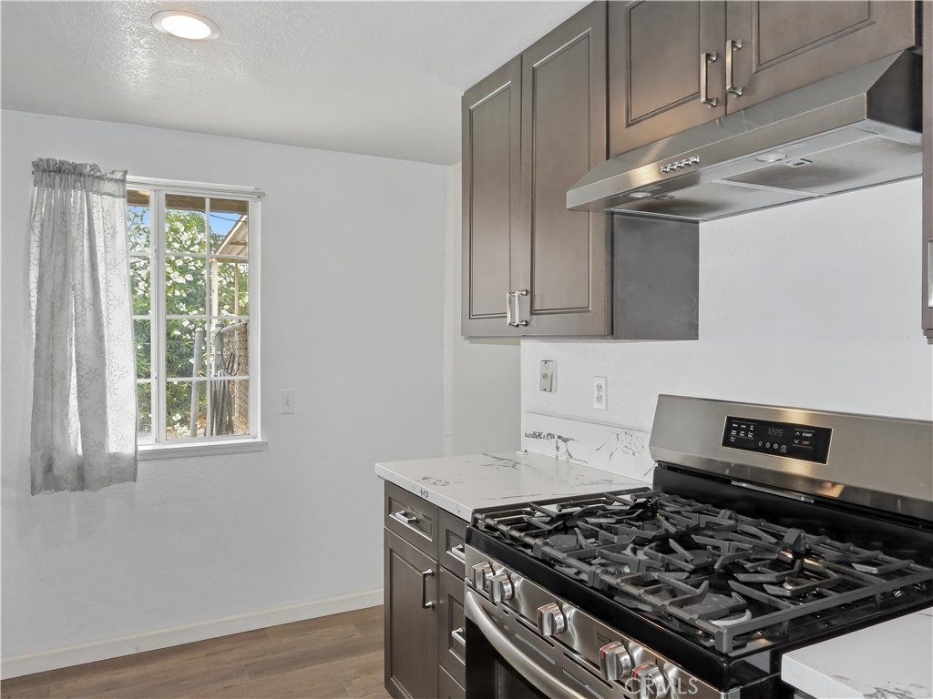 4409 Challen Avenue Riverside, CA 92503 - Photo 12 of 31 a stove top oven sitting inside of a kitchen