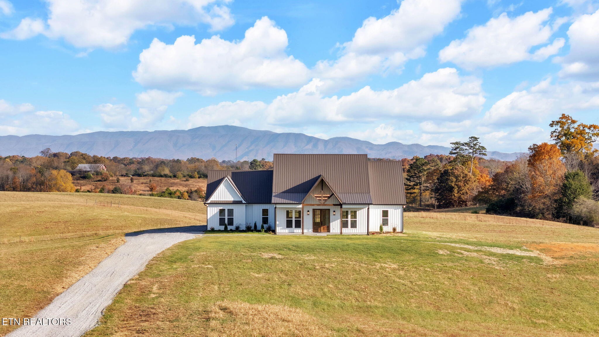 a view of a lake with a houses in the background