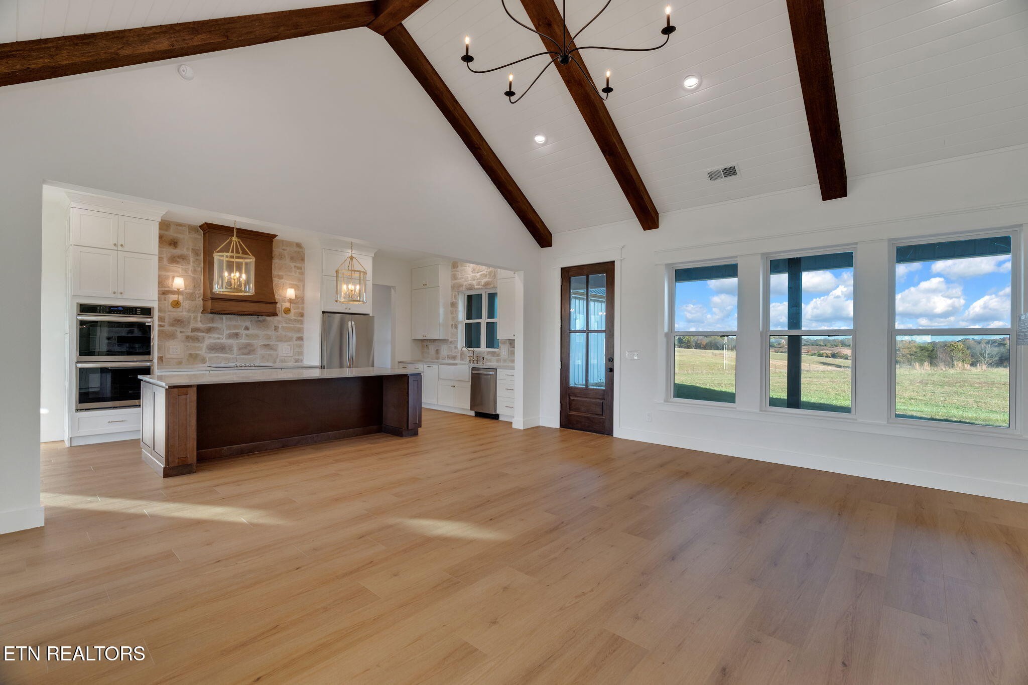 245 Pates Hill Road Mosheim, TN 37818 - Photo 11 of 35 a view of an empty room with a fireplace and a window