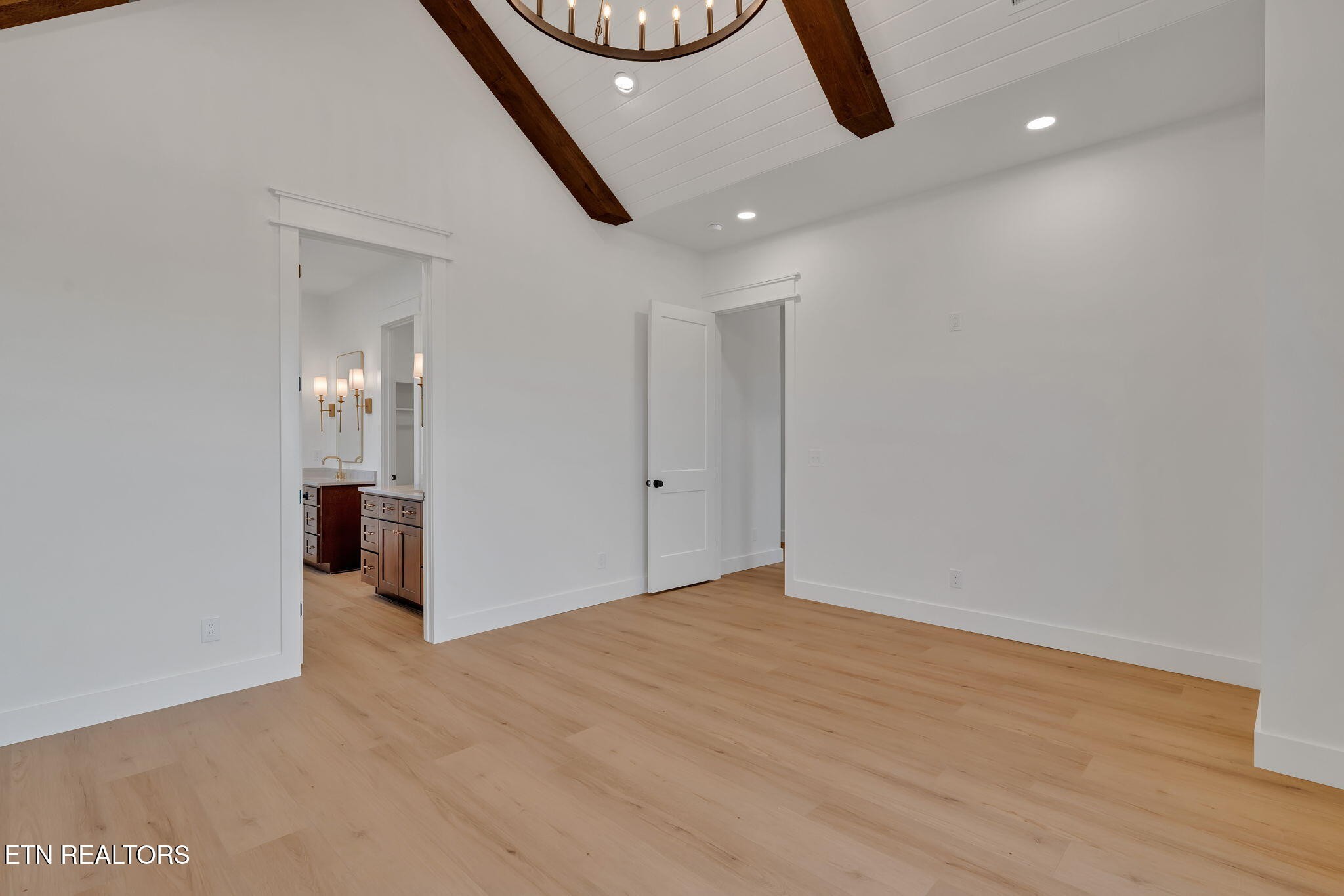 245 Pates Hill Road Mosheim, TN 37818 - Photo 12 of 35 an empty room with wooden floor and windows