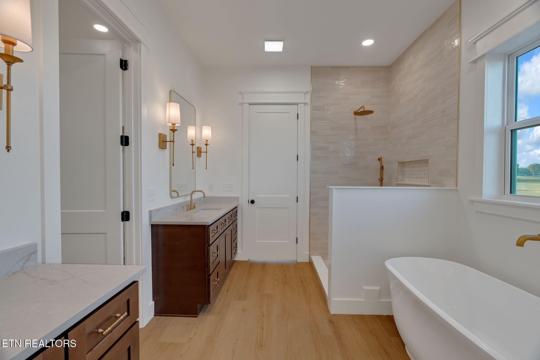 245 Pates Hill Road Mosheim, TN 37818 - Photo 14 of 35 a bathroom with a tub sink and mirror