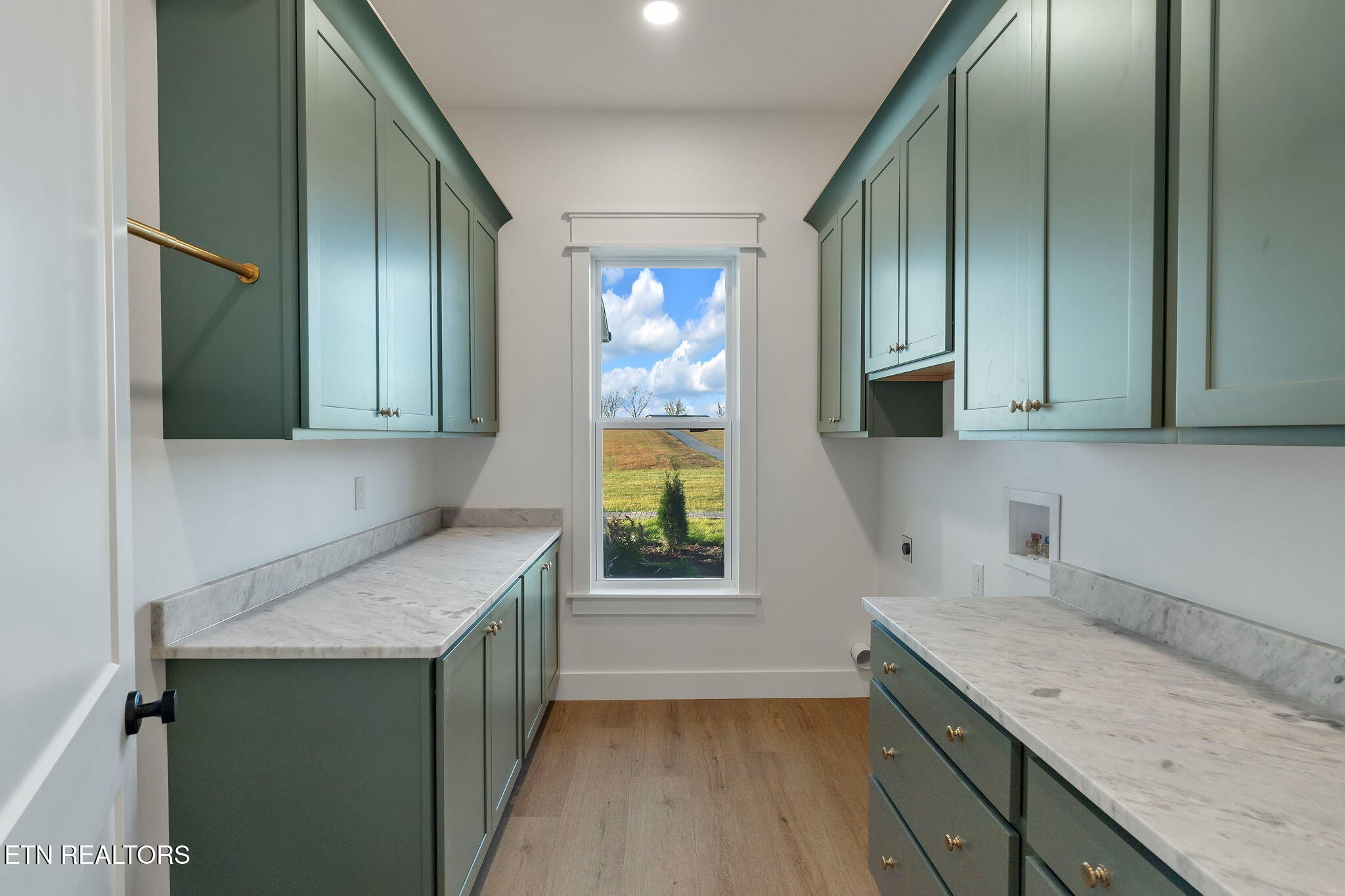 245 Pates Hill Road Mosheim, TN 37818 - Photo 20 of 35 a kitchen with a sink a counter top space cabinets and a window