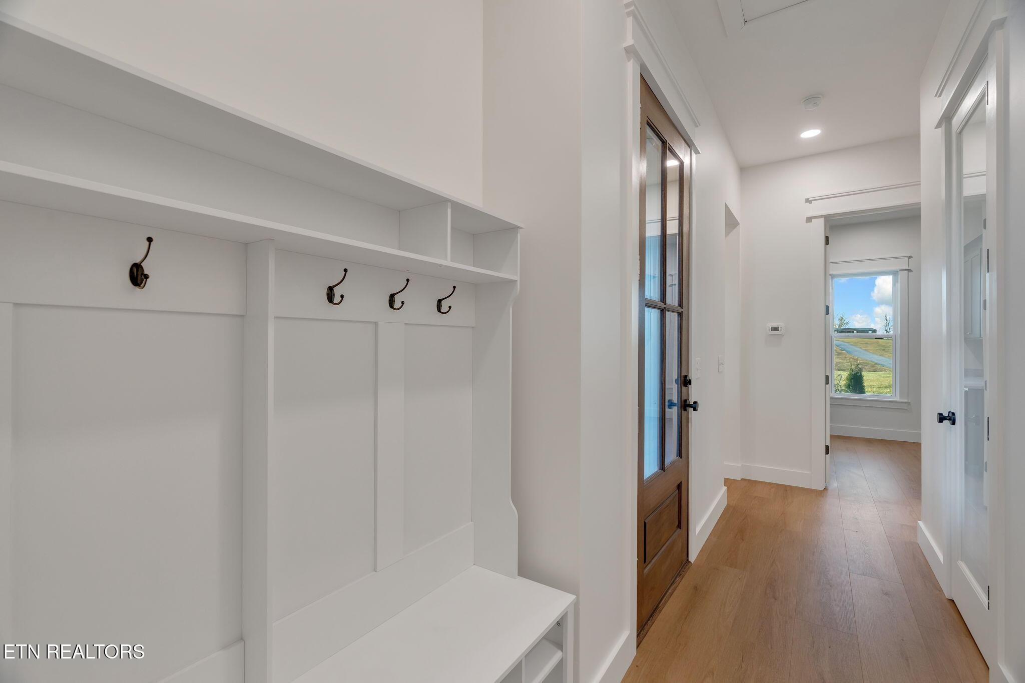 245 Pates Hill Road Mosheim, TN 37818 - Photo 22 of 35 a view of a hallway with wooden floor