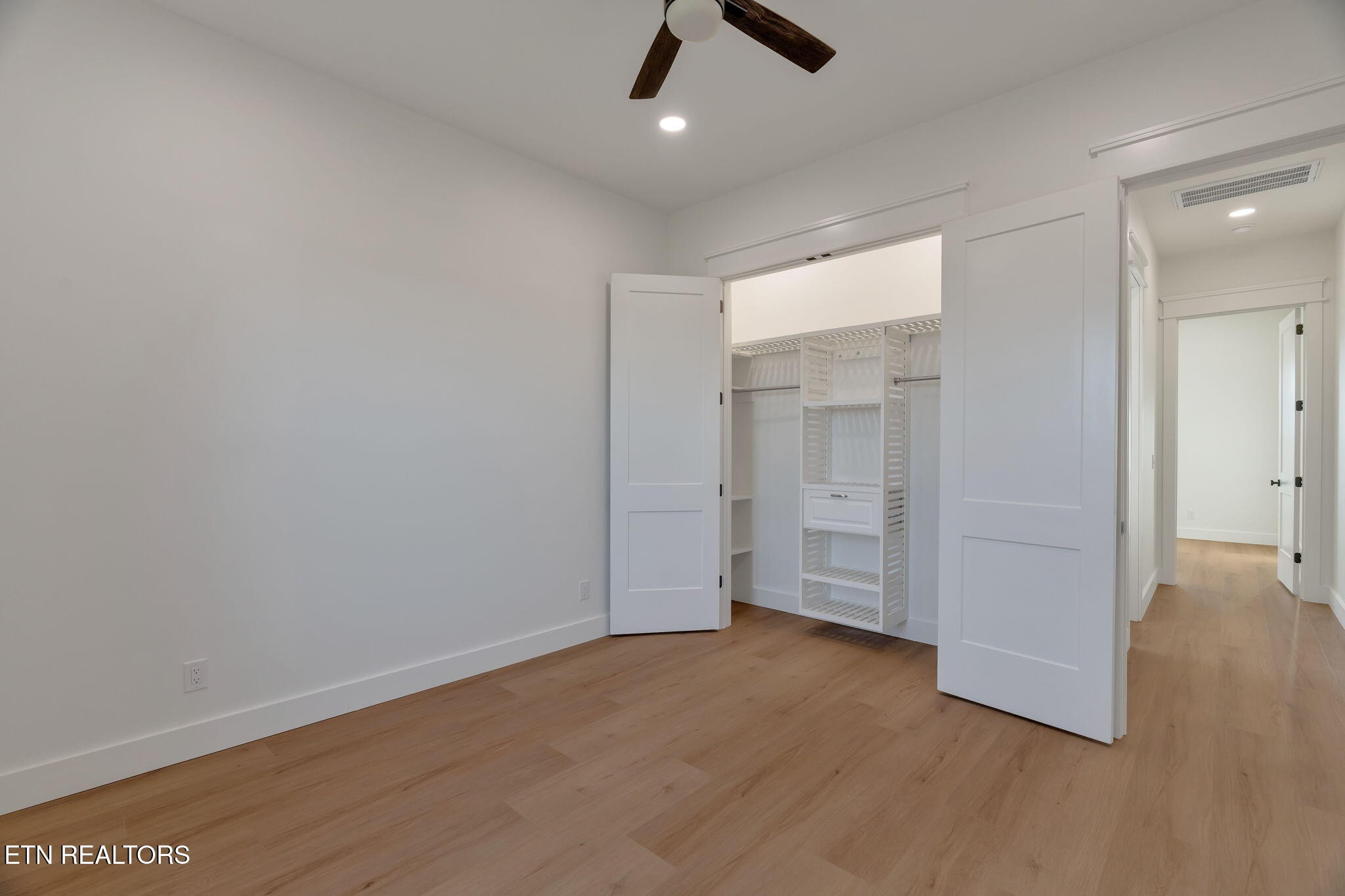 245 Pates Hill Road Mosheim, TN 37818 - Photo 24 of 35 wooden floor in an empty room