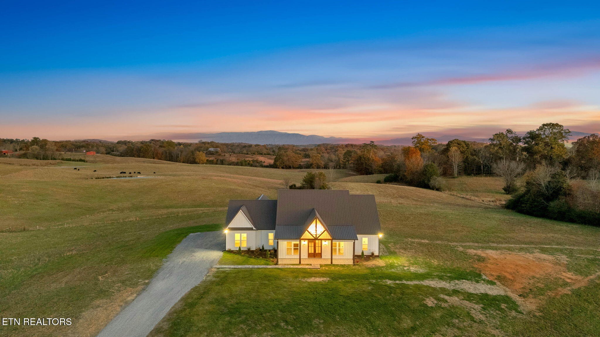 245 Pates Hill Road Mosheim, TN 37818 - Photo 30 of 35 a view of a lake with a big yard