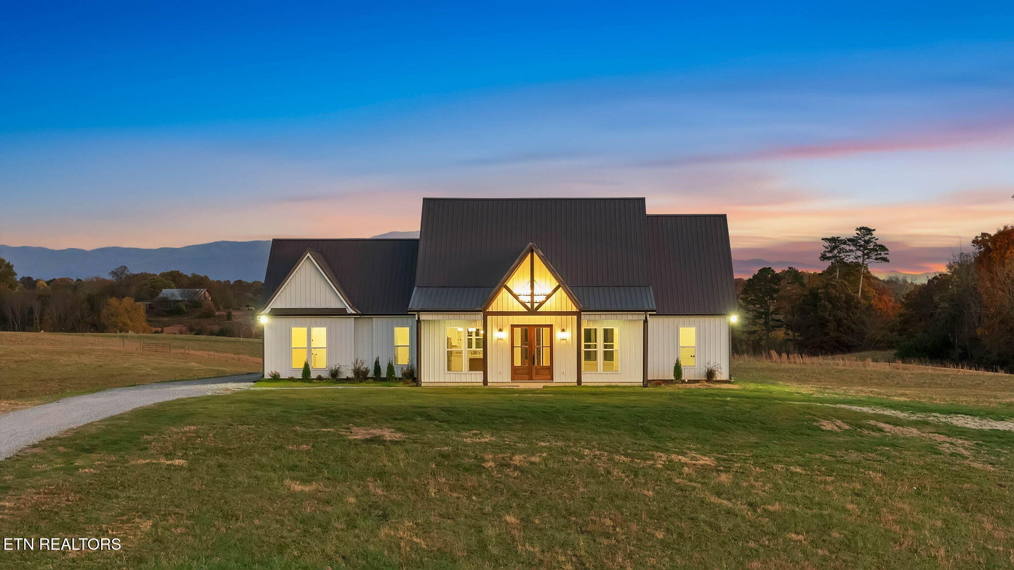 245 Pates Hill Road Mosheim, TN 37818 - Photo 3 of 35 a front view of a house with a yard