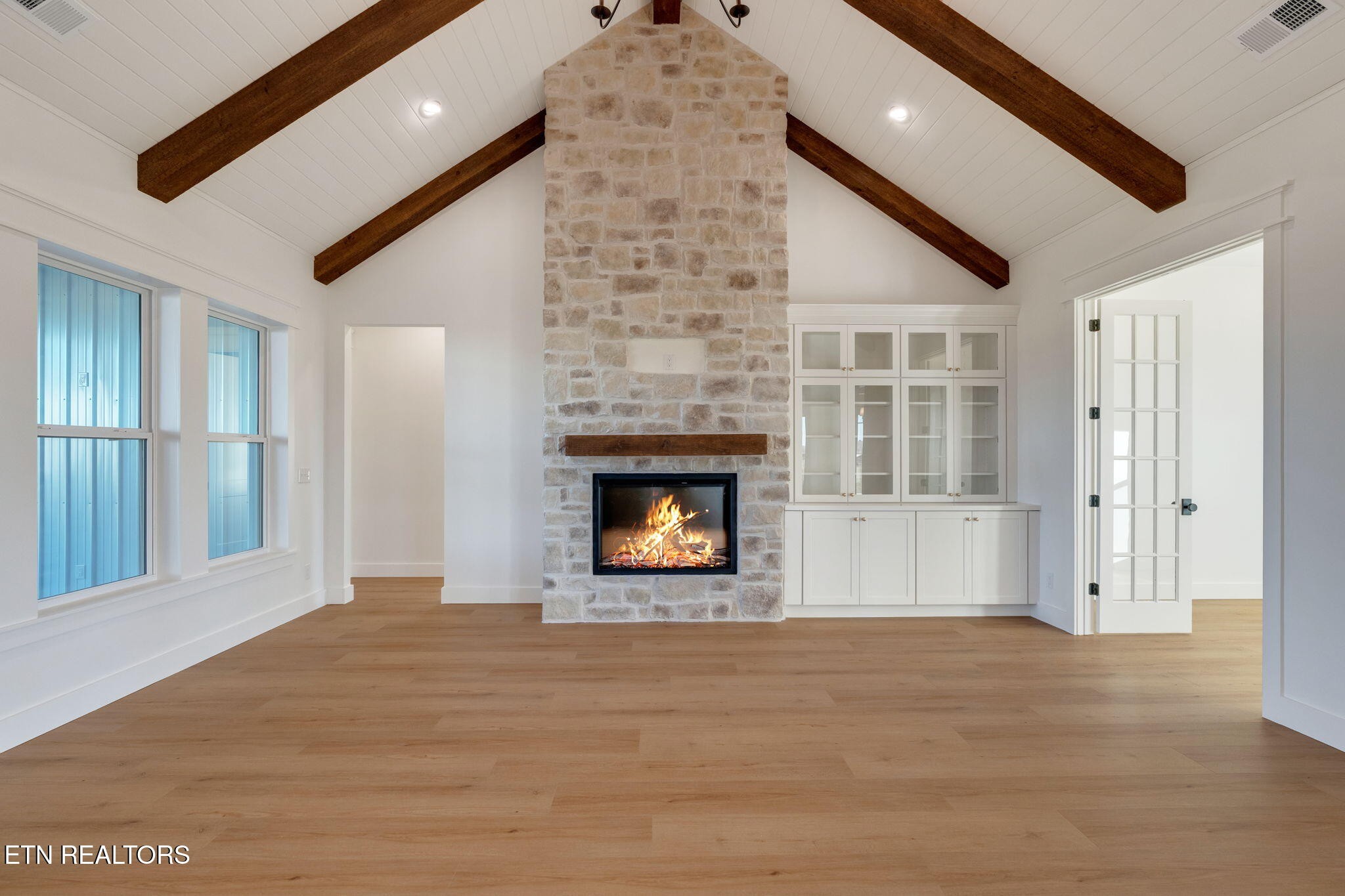245 Pates Hill Road Mosheim, TN 37818 - Photo 5 of 35 a view of an empty room with a window and fireplace