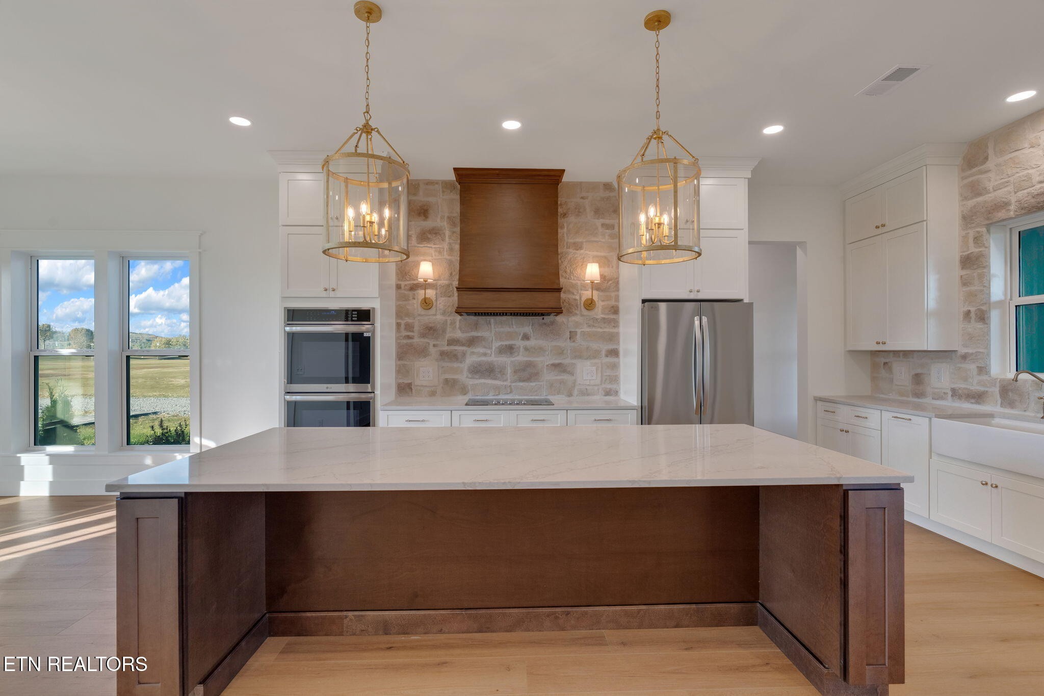 245 Pates Hill Road Mosheim, TN 37818 - Photo 7 of 35 a view of a kitchen with granite countertop a sink and dishwasher with wooden floor