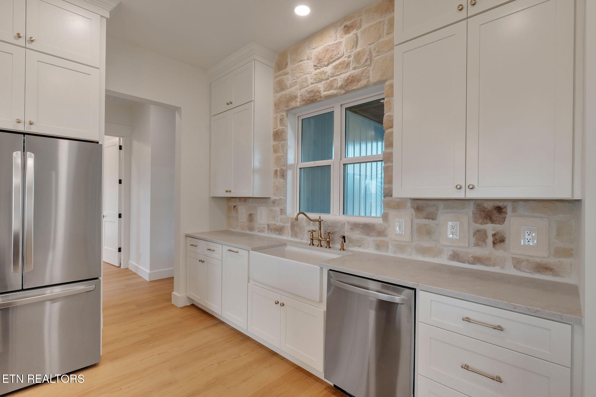 245 Pates Hill Road Mosheim, TN 37818 - Photo 10 of 35 a kitchen with a refrigerator sink and cabinets
