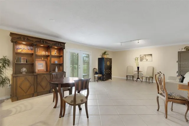 a view of a dining room with furniture and window