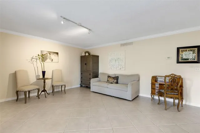 a living room with furniture and a table