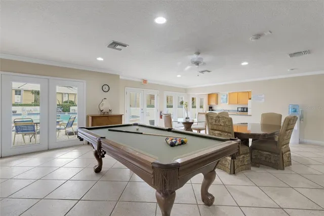 a kitchen with stainless steel appliances granite countertop a refrigerator and a stove