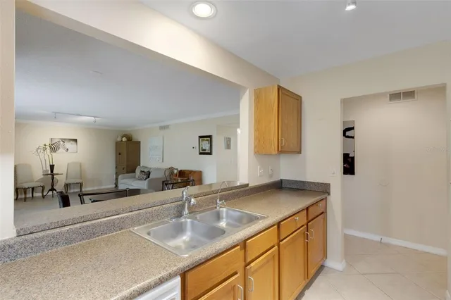 a kitchen with a sink and a refrigerator