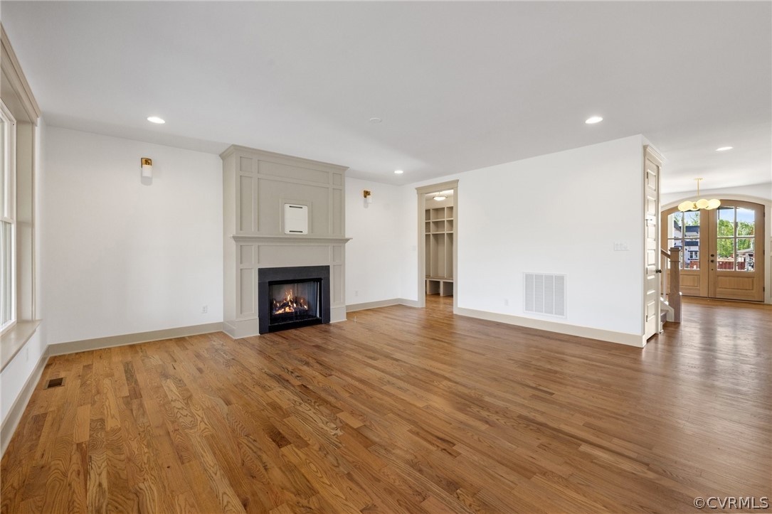 3501 Heaton Drive Midlothian, VA 23112 - Photo 12 of 41 a view of an empty room with wooden floor fireplace and a window