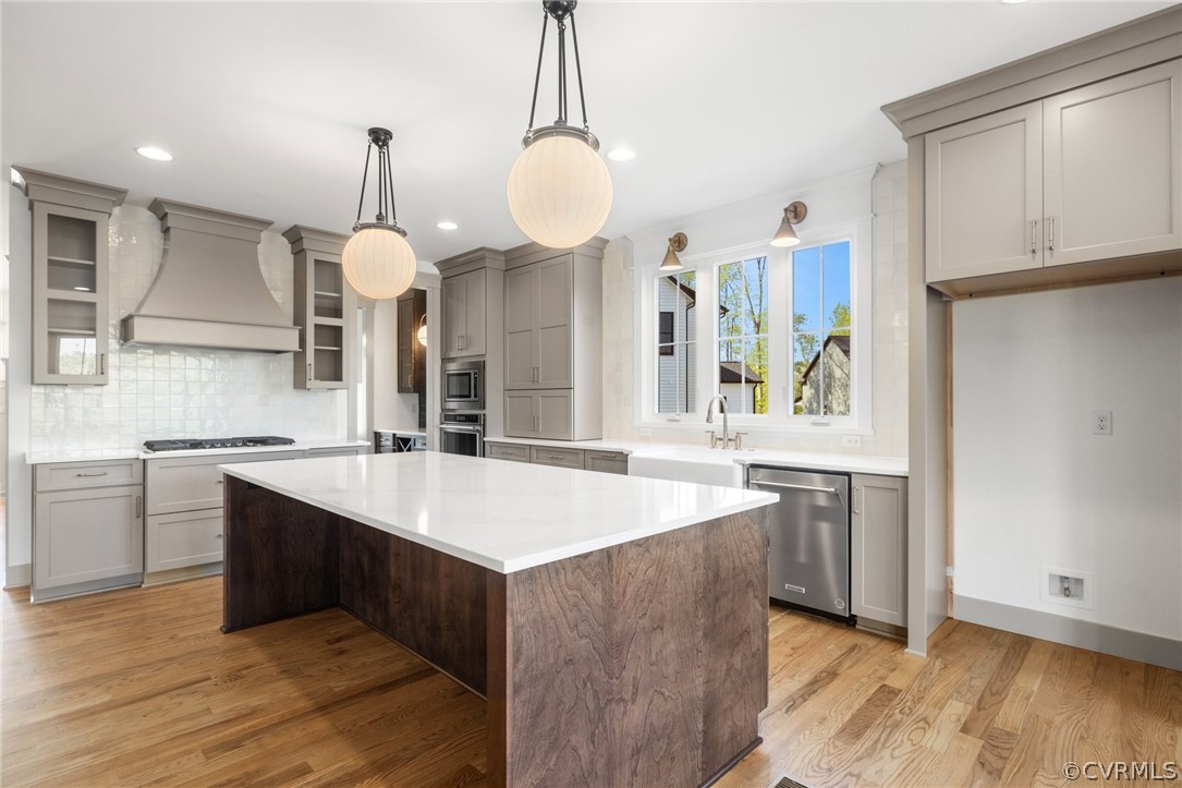 3501 Heaton Drive Midlothian, VA 23112 - Photo 13 of 41 a large kitchen with kitchen island a sink stainless steel appliances and a chandelier