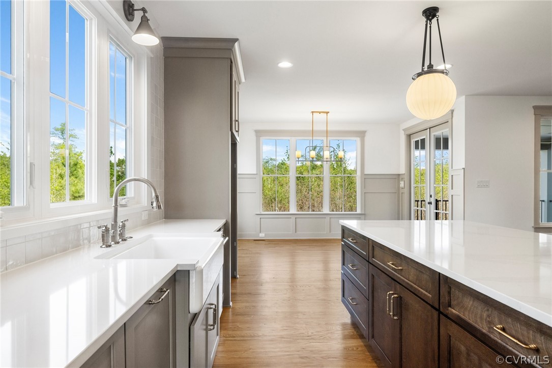 3501 Heaton Drive Midlothian, VA 23112 - Photo 17 of 41 a large kitchen with kitchen island a large counter space a sink appliances and a large window