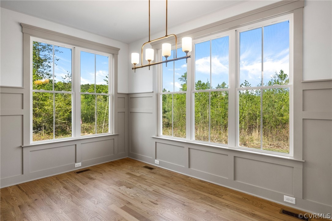 3501 Heaton Drive Midlothian, VA 23112 - Photo 21 of 41 a view of an empty room with wooden floor and a window