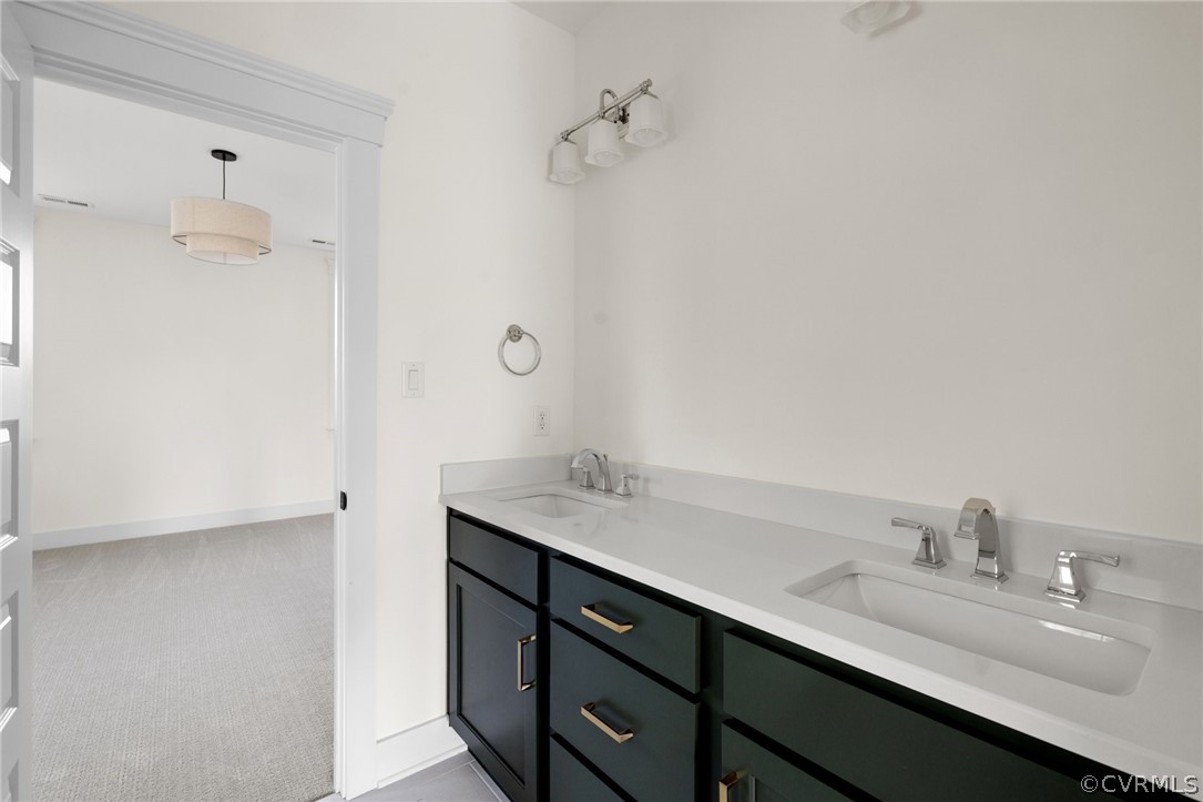 3501 Heaton Drive Midlothian, VA 23112 - Photo 34 of 41 a bathroom with a granite countertop sink and a mirror