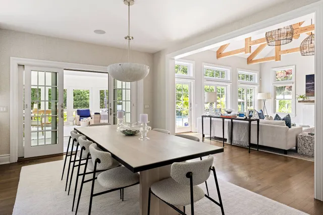 a dining room with furniture and window