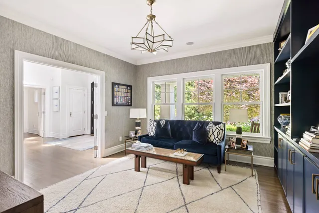 a spacious bedroom with a balcony a bed and a fireplace